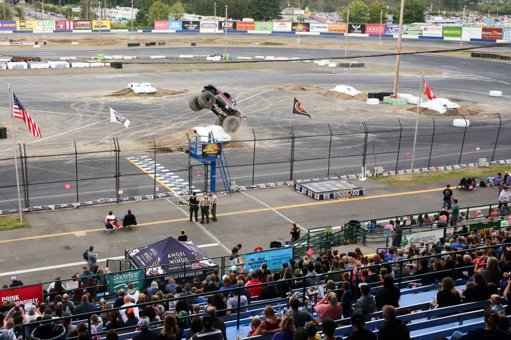 Hundreds gathered to watch monster trucks and other races Friday evening during the Evergreen State Fair at the Evergreen Speedway in Monroe. (Kevin Clark / The Herald)