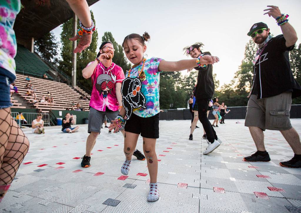 Skye Bassett, 6, dances with her family during Jai Wolfs rescheduled performance at Bumbershoot Music & Arts Festival on Sunday, Sept. 1, 2019 in Seattle, Wash. (Olivia Vanni / The Herald)