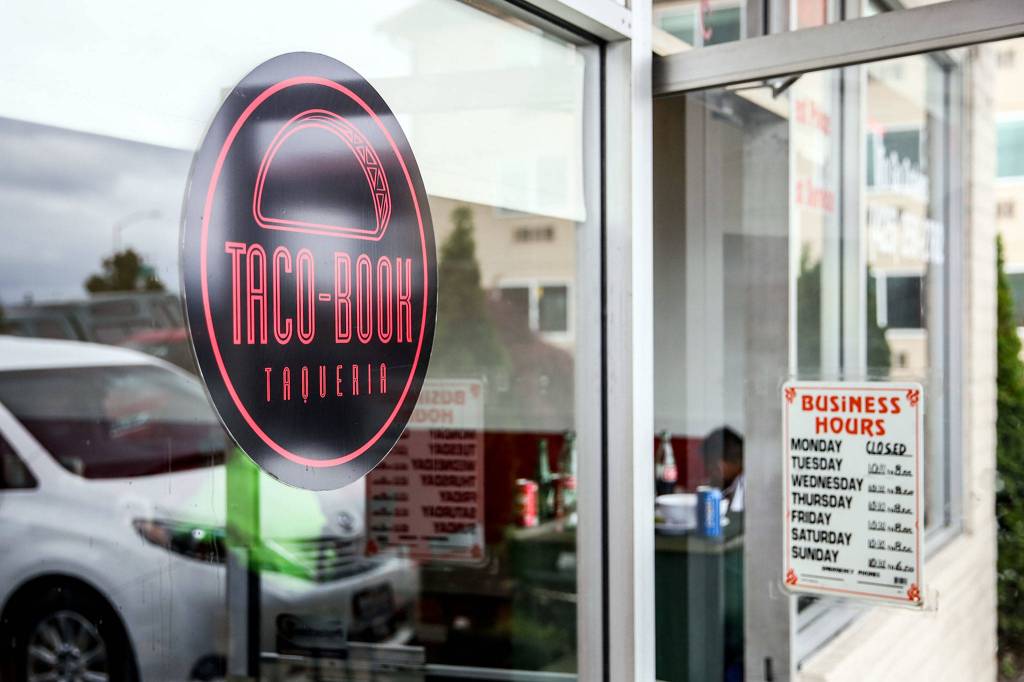 A law firm representing Facebook made Taco-Book change its original red and blue logo, lowercase font, small t and thumbs up, saying it was copying the social media giant. (Kevin Clark / The Herald)