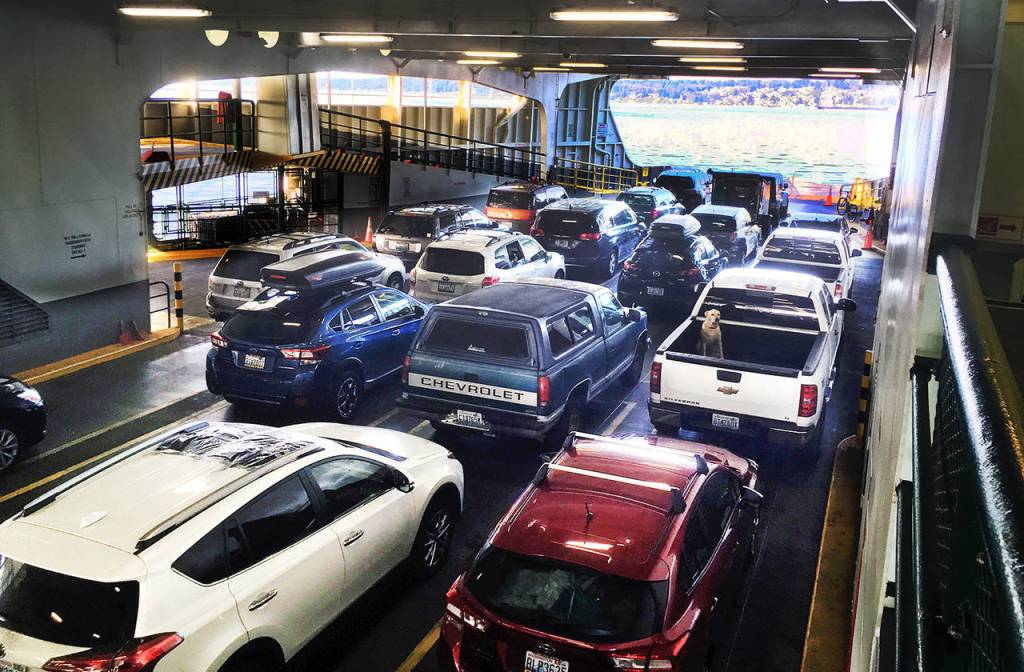 Cars ride the Walla Walla ferry from Seattle to Bremerton on Aug. 4. (Sue Misao / The Herald)