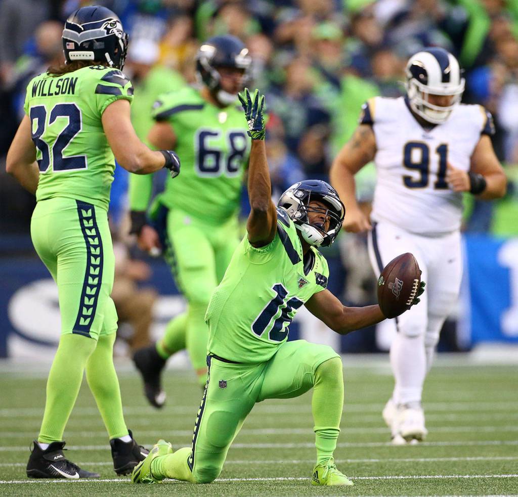 Seattles Tyler Lockett celebrates a first down during the Seahawks 30-29 win over the L.A. Rams on Thursday at CenturyLink Field in Seattle. (Kevin Clark / The Herald)