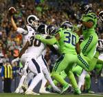 Seattle defenders collapse the pocket around L.A. Rams quarterback Jared Goff during the Seahawks 30-29 win over the L.A. Rams on Thursday at CenturyLink Field in Seattle.. (Kevin Clark / The Herald)