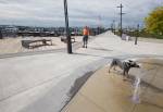 Pepper takes a drink from the new water fountain display while on a walk with his owner, Mike Williams, at the Port of Everett on Wednesday in Everett. The Boats Afloat Show, which has been held on Seattles South Lake Union for some 30 years, is relocating to the Port of Everett next fall. (Andy Bronson / The Herald)