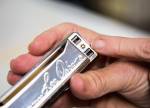 A small removable screw allows for reed plates to be replaced in a Lee Oskar Harmonica. (Olivia Vanni / The Herald)