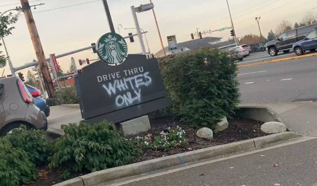 A screenshot from a video posted by Shar Bennett shows hateful graffiti tagged on a Starbucks drive-thru sign at Pacific Highway S and S 288th Street. Courtesy photo