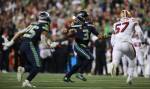 Seattle Seahawks Russell Wilson runs forward to throw a touchdown pass as the Seattle Seahawks lost to the San Francisco 49ers 26-21 at CenturyLink Field on Sunday, Dec. 29, 2019 in Seattle, Wash. (Andy Bronson / The Herald)