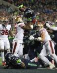 Seattle Seahawks Marshawn Lynch reaches up and over for a touchdown as the Seattle Seahawks lost to the San Francisco 49ers 26-21 at CenturyLink Field on Sunday, Dec. 29, 2019 in Seattle, Wash. (Andy Bronson / The Herald)