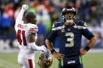 Seattle Seahawks Russell Wilson watches the replay as San Franciscos Emmanuel Moseley celebrates the 49ers win, 26-21, Sunday evening at CenturyLink Field in Seattle on December 29, 2019. (Kevin Clark / The Herald)
