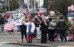 Samiu Bloomfields friends and fans gather on Broadway to honor him Monday in Everett. (Andy Bronson / The Herald)