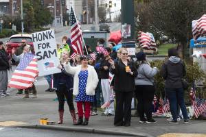 Honks, waves, flags and flowers for Everett’s tattooed patriot