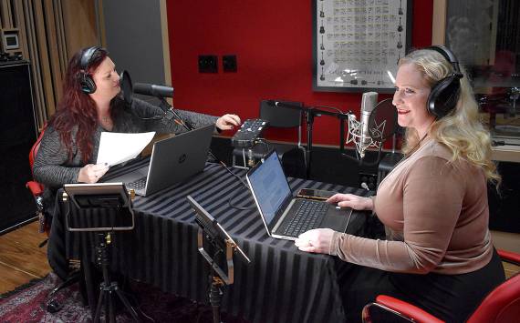 Photo by Haley Ausbun. Kim Shepard (left) and Carolyn Ossorio (right) launched a new true crime podcast, recorded at a sleek studio in Coal Creek. Ossorio is a former Renton Reporter columnist and both hosts previously worked at KIRO radio.