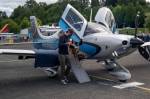 After a three-hour flight, co-pilot Everett King helps rescue pup Andy get off the plane, May 23, 2020, at Renton Municipal Airport. Photo by Andre Osorio/For the Renton Reporter