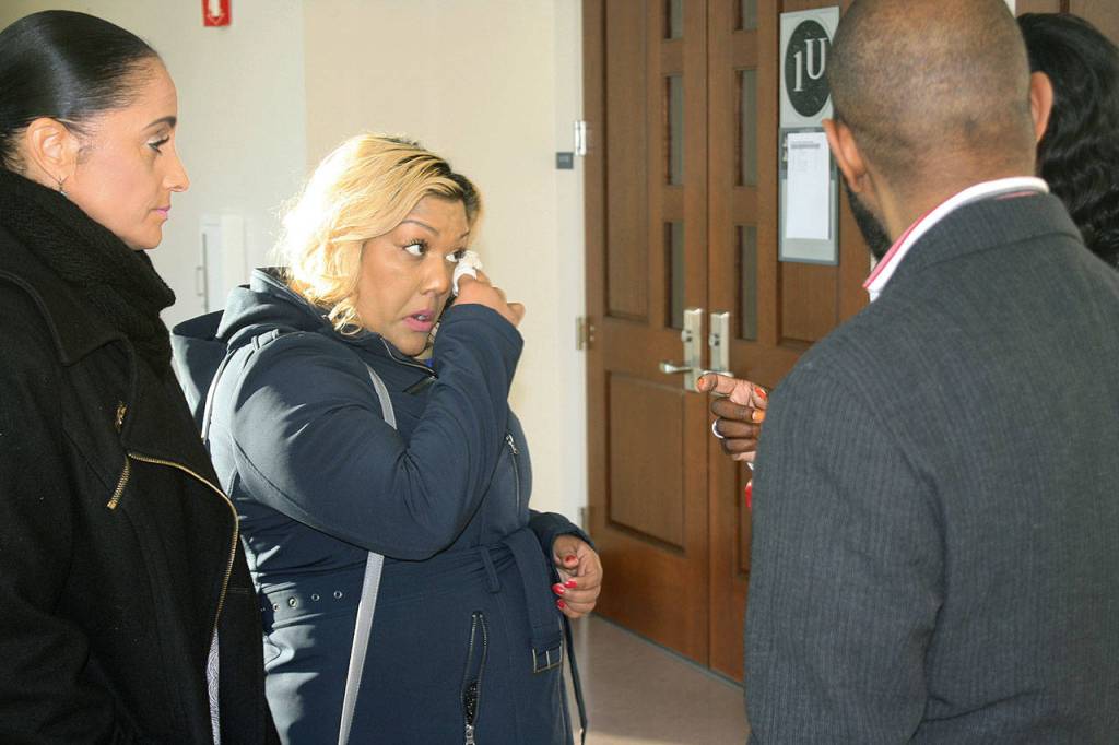 Sonia Joseph wipes away a tear in this December 2017 photo prior to entering the inquest hearing at the Maleng Regional Justice Center in Kent into the fatal shooting of her son Giovonn Joseph-McDade by a Kent Police officer in June 2017. King County has not held any inquests into officer-involved shootings since the Joseph-McDade case. FILE PHOTO, Kent Reporter