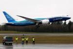 Workers cheer and wave as Boeings 787 Dreamliner takes off from Paine Field on Dec. 15, 2009. (Justin Best/ Herald file)