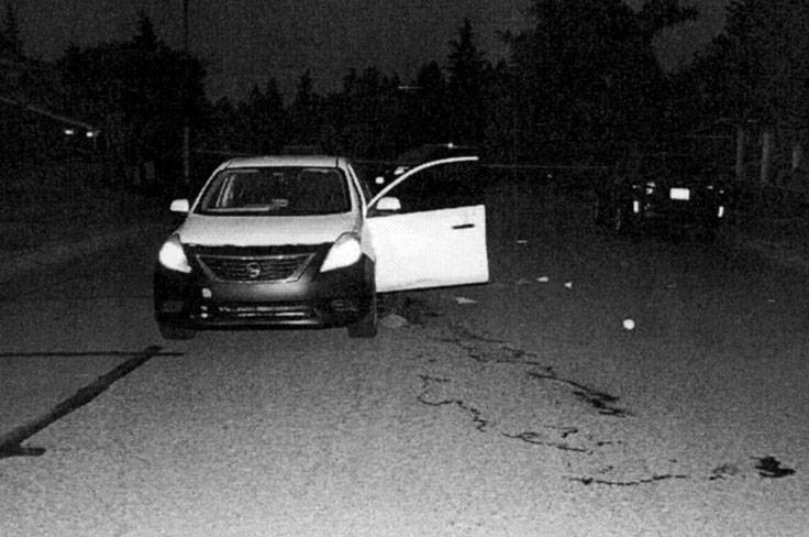 Crime scene photo shows the Nissan Versa driven by Travis Zimmerman, a newspaper carrier who was shot by Daniel McLaughlin in May 2019. Courtesy of King County Superior Court.