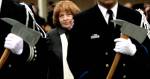 Kathy Parks, wife of slain firefighter Gary Parks, walks in a processional to place a flower on the memorial for her husband on the Everett Community College campus in 2012. (Michael OLeary / Herald file)