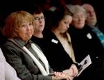 Kathy Parks and family members listen to speakers during the Gary Parks Remembrance ceremony at Everett Community College in 2012. From left: Kathy Parks, daughter Jennifer Parks, granddaughter Marissa Van Ry, Carol and bother John Parks. (Michael OLeary / Herald file)