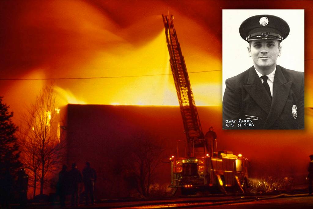 Michael O'Leary / Herald File 1987
A ladder truck shoots water over the south wall of the Everett Community College library complex on Feb. 16, 1987.  The arson destroyed the facility and killed Everett firefighter Gary Parks.