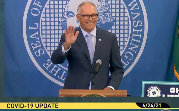 Gov. Jay Inslee waves during his Thursday morning press conference on extending protections for renters. (TVW)