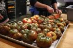 Sarah Cassidy and Chef Kyle Bopes prep heirloom tomatoes from Hearth Farm. Photo by Cameron Sheppard/Sound Publishing