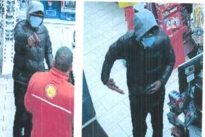 Surveillance photos of the 28-year-old Seattle man who has been arrested and charged with 12 counts of first-degree robbery. (Photos taken from charging documents)