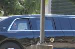 A man who appears to be President Joe Biden is seen in the back seat of a car in the presidents motorcade, departing the Green River College after the presidents speech. Photo by Alex Bruell/Sound Publishing