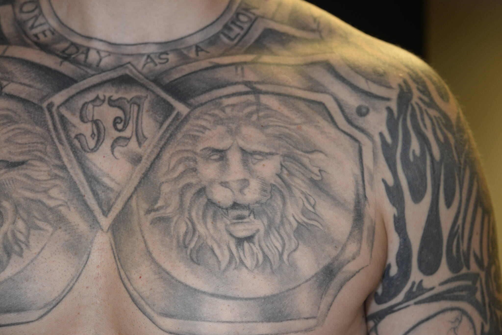 Nelson has a partial quote from Fascist dictator Benito Mussolini tattooed around his neck. The full quote reads It is better to live one day as a lion than 100 years as a sheep. Courtesy photo