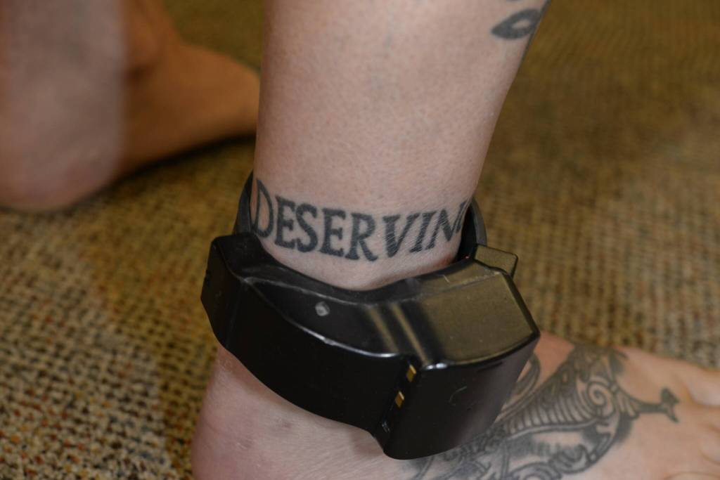 Nelsons ankle tattoo reads punish the deserving. These photos were taken by the FBI after Nelson was charged with murder. Courtesy photo