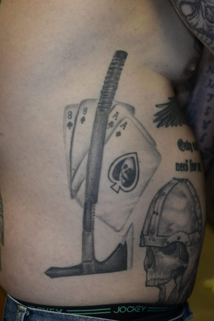 Tattoos on Nelsons right side of the dead mans hand two eights and two aces, underneath a tomahawk style axe. These photos were taken by the FBI after Nelson was charged with murder. Courtesy photo