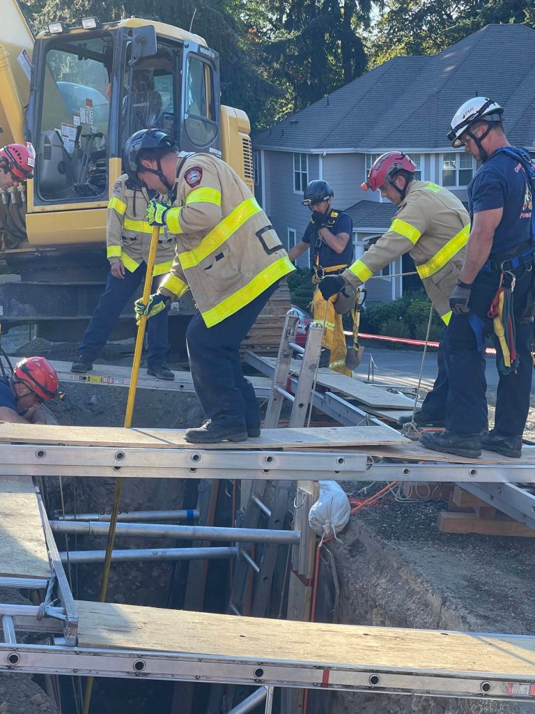 What started out as a rescue operation became a recovery operation when a responder found that Surjit Gill had no pulse. Between 50 and 60 responders worked for hours to make sure the trench was stable enough for recovery. Photo courtesy of Renton Regional Fire Authority.