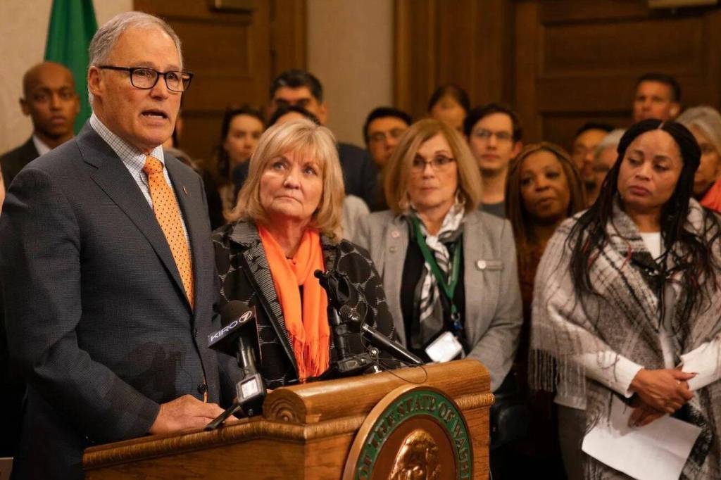 Gov. Jay Inslee, left, with First Lady Trudi Inslee at a press conference advocating for laws to prevent gun violence. (Provided by the Washington State Governors Office)