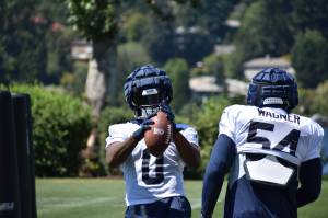 Devin Bush in front, working on his hands with fellow linebacker Bobby Wagner. (Photos by Ben Ray/Sound Publishing)
