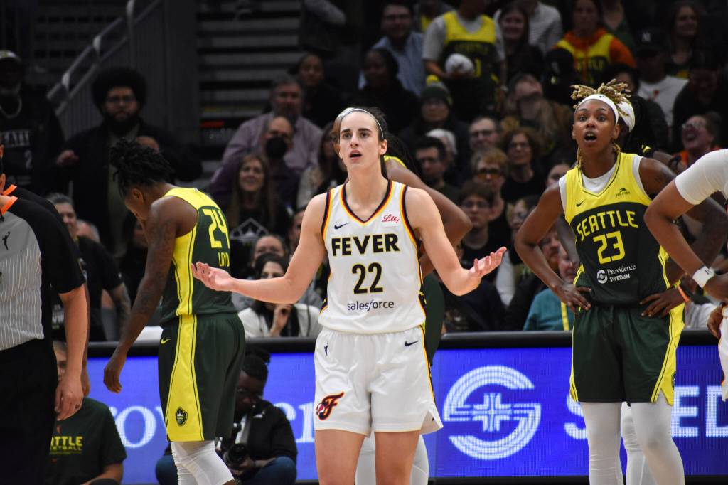 Caitlin Clark of the Indiana Fever shrugs as she looked for a foul on a three-point attempt in the fourth quarter against the Seattle Storm. Ben Ray / The Mirror