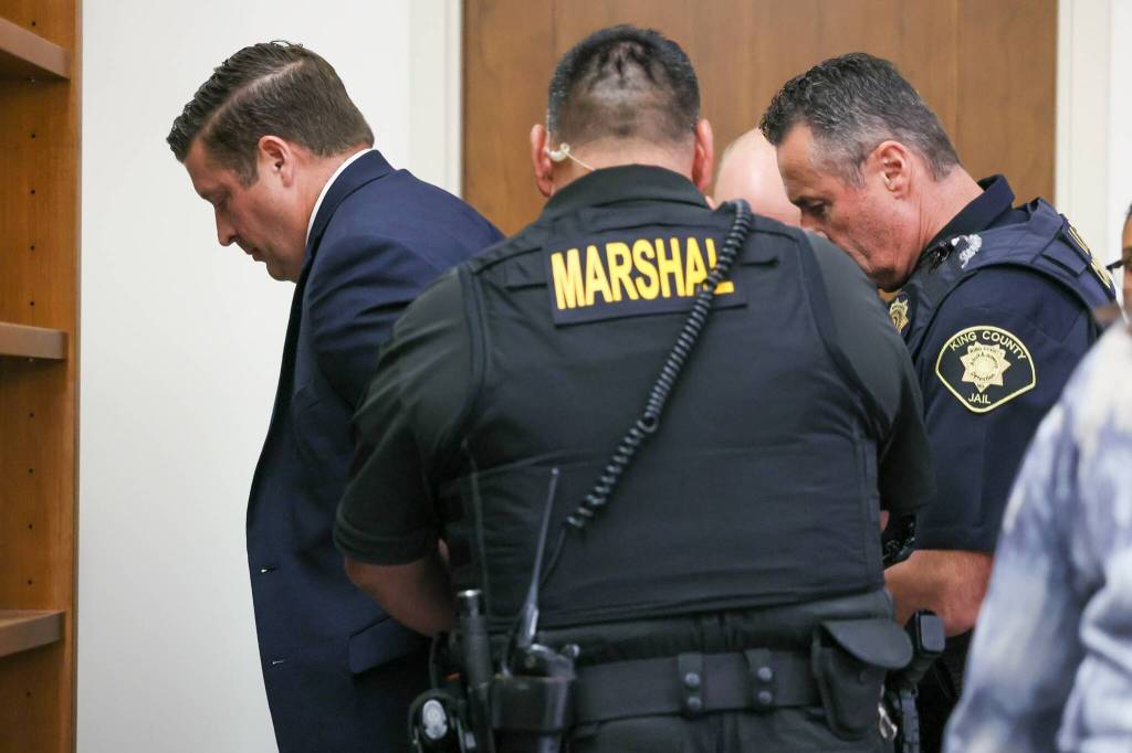 Auburn Police Officer Jeffrey Nelson is taken into custody after two guilty verdicts were handed down by the jury Thursday, June 27, at the King County Maleng Regional Justice Center in Kent. (Ken Lambert / The Seattle Times / Pool)