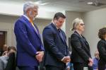Auburn Police Officer Jeffrey Nelson, flanked by attorneys, stands as two guilty verdicts are handed down June 27 at the King County Maleng Regional Justice Center in Kent. (Ken Lambert / The Seattle Times / Pool)