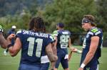 Seahawks wide receivers Jaxon Smith-Njigba and Jake Bobo chatting during the warm-up section of practice. Photos by Ben Ray / Sound Publishing