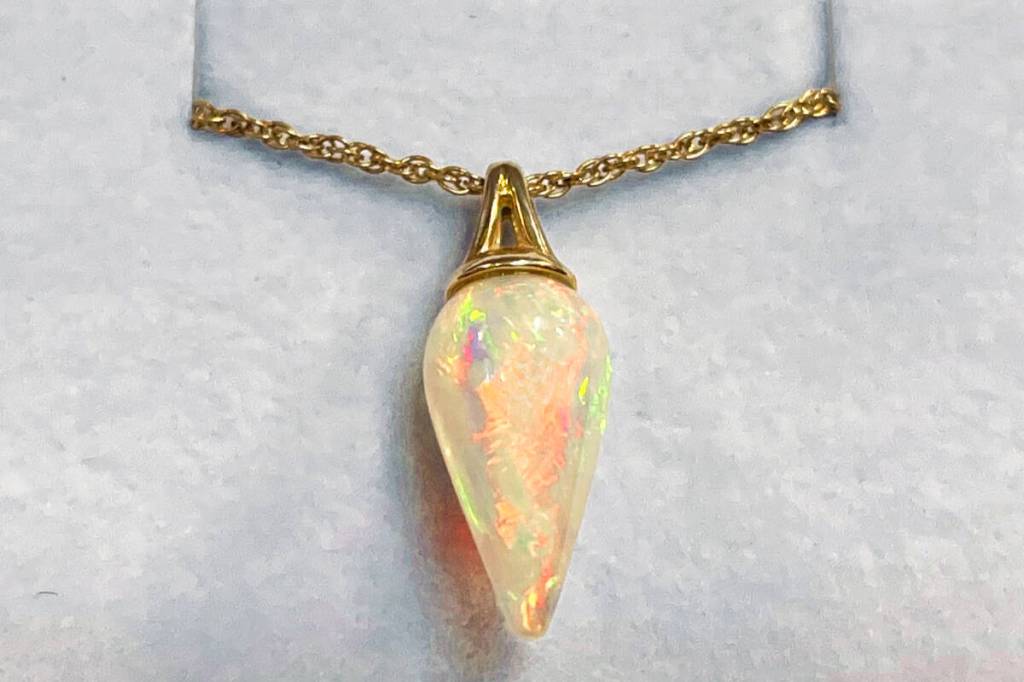 Raffle prize: 14k yellow gold and natural Ethiopian opal pendant valued at $1,250, donated by Federal Way Custom Jewelers. Photo courtesy of Valley Cities Behavioral Health Care.