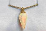 Raffle prize: 14k yellow gold and natural Ethiopian opal pendant valued at $1,250, donated by Federal Way Custom Jewelers. Photo courtesy of Valley Cities Behavioral Health Care.