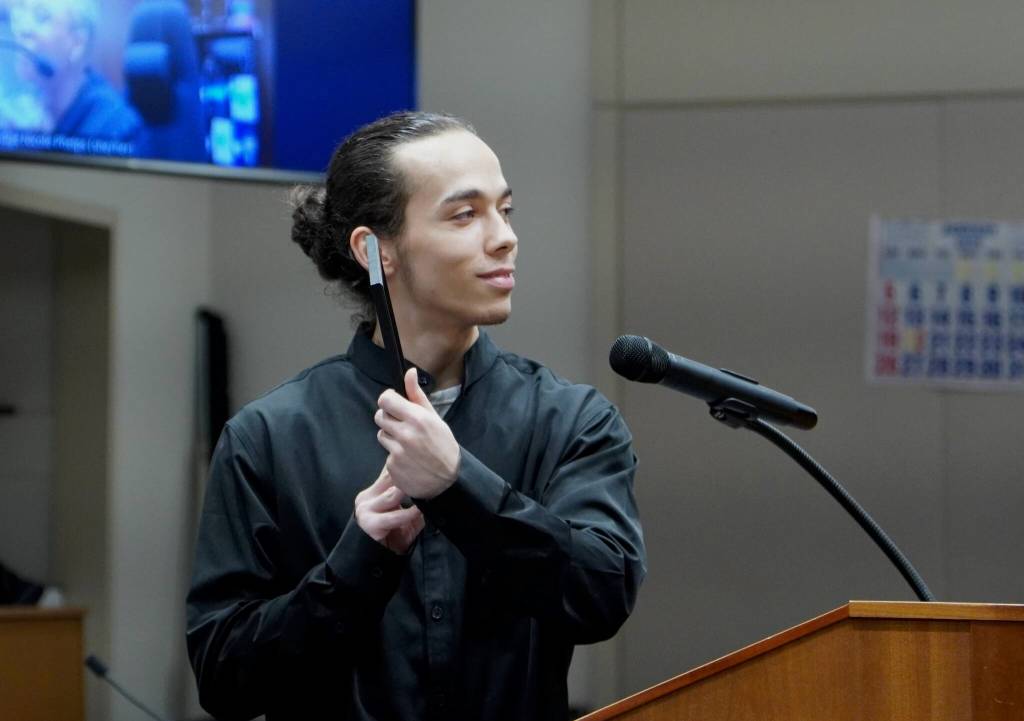 Koleton Hart, Jesse Sareys younger brother, showing the judge a photo of him, Jesse and family. Photo by Joshua Solorzano/Sound Publishing