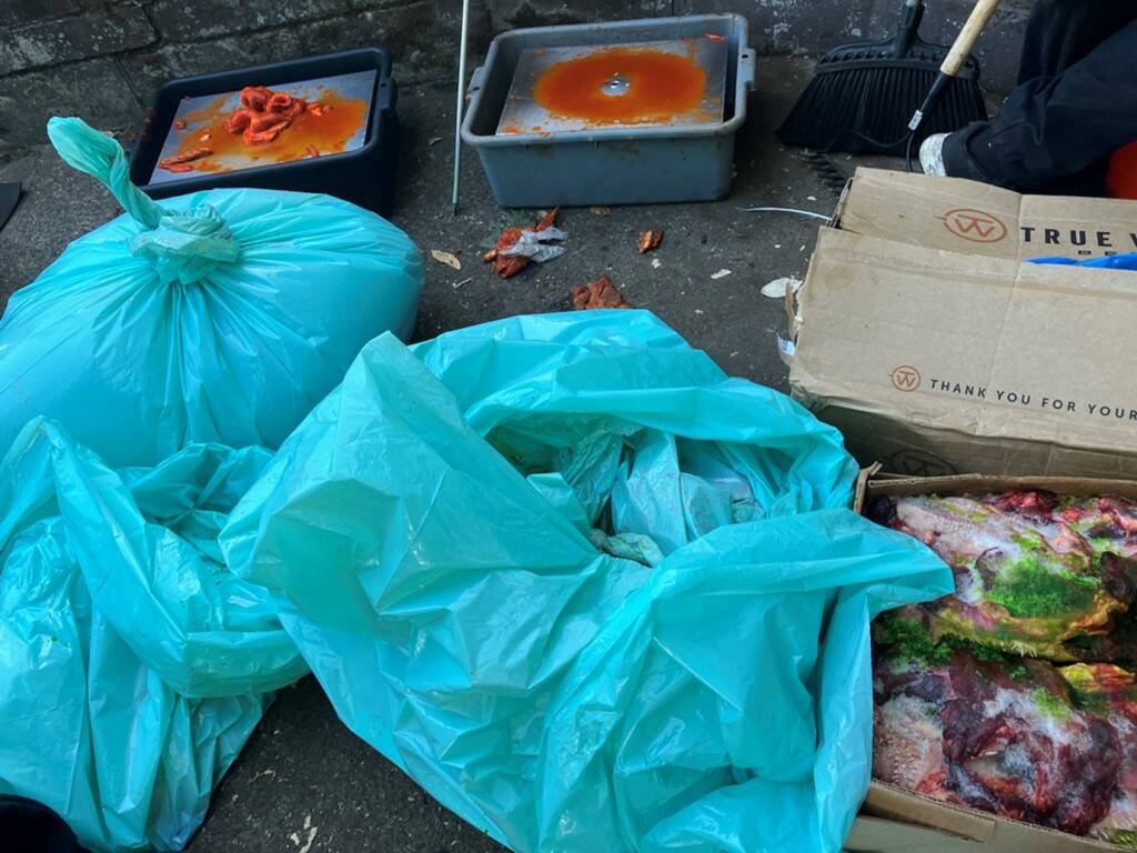 The Tacoma-Pierce County Health Department found meat being stored outside and next to trash at a home being used as a kitchen space by multiple unpermitted roadside food vendors in Pierce County. Photo courtesy of the Tacoma-Pierce County Health Department