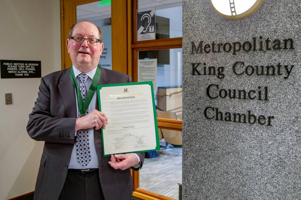 Dwight Dively poses with the proclamation and the MLK Medal of Distinguished Service. Photo courtesy of King County
