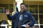 Seahawks head coach Mike Macdonald waves and holds the Lombardi Trophy during the parade. Photos by Ben Ray / Sound Publishing