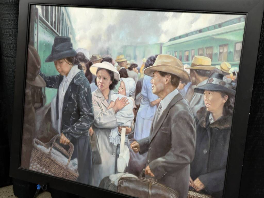 Images of the journey to U.S. concentration camps are shown in Chris Hopkins paintings. Photo by Bailey Jo Josie/Sound Publishing