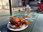 Hollywood Taverns burger, sweet potato fries and whiskey on the patio. Photo by Mindy Stern