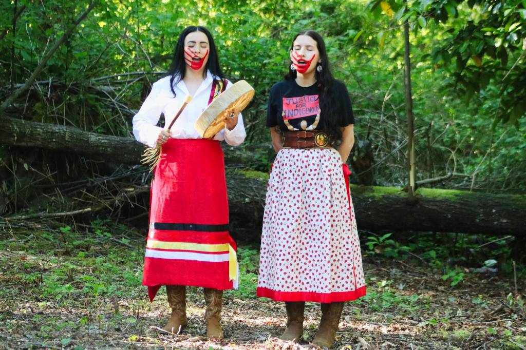 Lauren Nabahe (Paute-Shoshone, Diné and Mono) of Seattle and Maya Rodriguez-Peltier (Turtle Mountain Ojibew and Nakota of White Bear First Nation) of Kirkland perform a song on Missing and Murdered Indigenous People Awareness Day on May 5, 2026. Photo by Bailey Jo Josie/Sound Publishing.