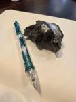 A piece of shrapnel from the front lines (pencil for scale). Photo by Keelin Everly-Lang / the Mirror.
