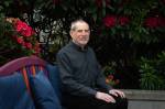 Photo by Moe K. Clark/InvestigateWest
Joel Levin, the co-founder and director of programs for the Seattle-based nonprofit Stop Sexual Assault in Schools, poses for a portrait outside his home on May 17, 2026. Levin co-founded his nonprofit in 2015 after a family member was sexually assaulted by a peer on a school field trip.