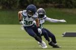 Two defensive backs; Ty Okada and Noah Igbinoghene participate in a drill. Photo provided by Maria Dorsten